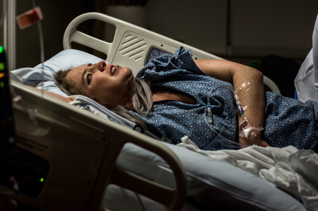 Photo of mom in hospital during labor charleston sc birth photographer