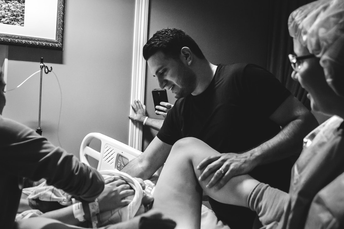 Picture of dad meeting baby for the first time