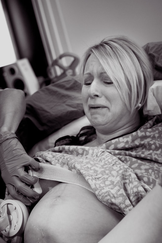 Black and white photo of a mother seeing her baby for the first time - Charleston, SC Birth photographer