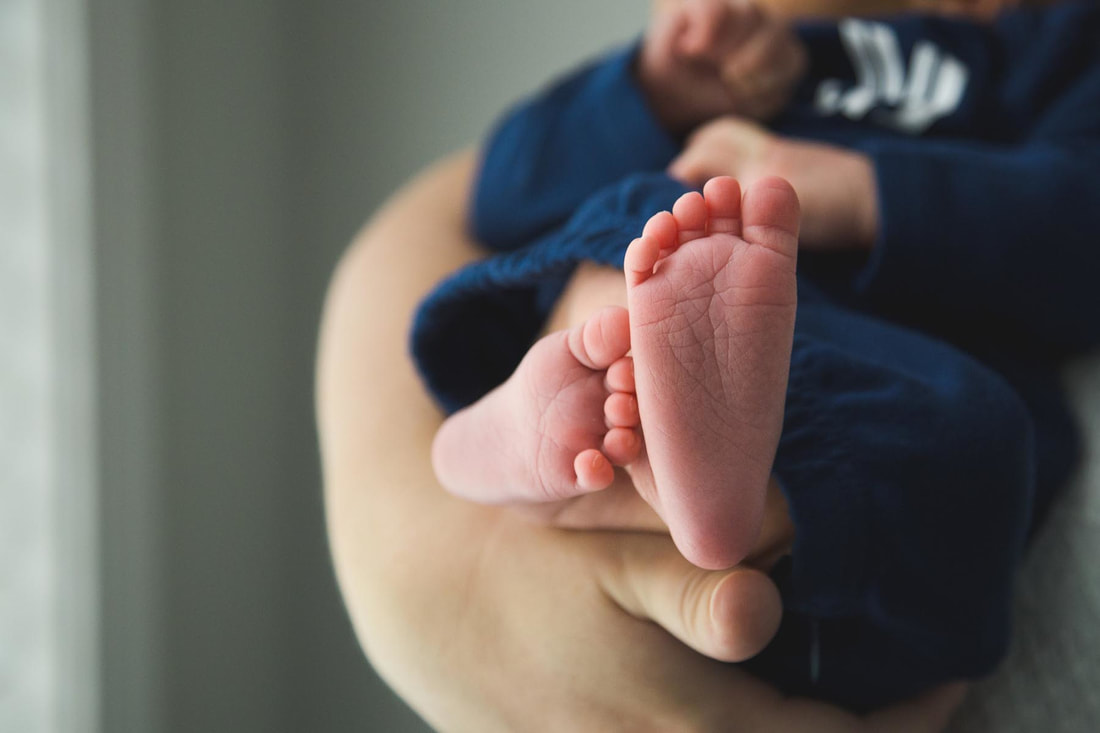 Photo of a newborn baby's feet during - newborn photography - lowcountry, charleston, sc